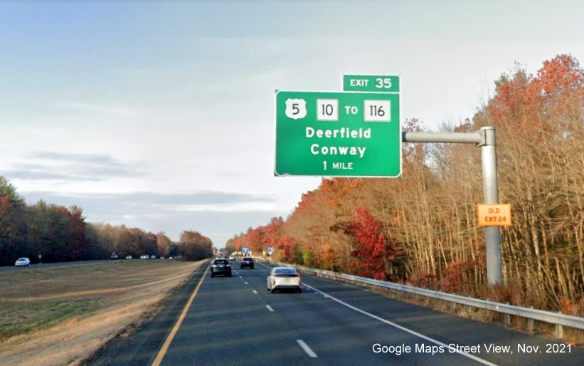 Image of 1 mile advance overhead sign for US 5/MA 10 to MA 116 exit with new milepost based exit number and yellow Old Exit 24 advisory sign on support on I-91 North in Deerfield, Google Maps Street View image, November 2021