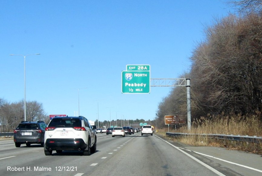 Image of 1/2 mile advance overhead sign for I-95/128 North exit with new milepost based exit number 
                                          on I-93 North in Woburn, December 2021