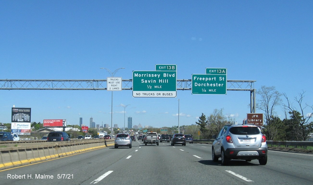 Image of overhead advance signs for Morrissey Blvd and Freeport Street exits with new milepost based exit numbers on I-93/Southeast Expressway North in Dorchester, May 2021