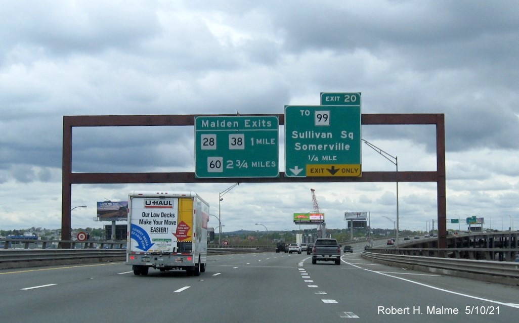 Image of 1/4 mile advance sign for To MA 99 exit with new milepost based exit number on I-93 North in Charlestown, May 2021