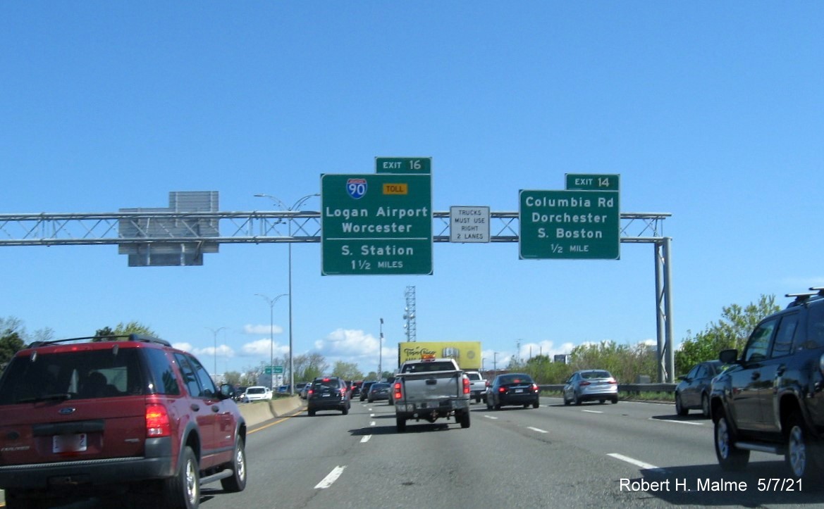 Image of overhead advance signs for I-90/South Station and Columbia Road exits with new milepost based exit numbers on I-93 North in Boston, May 2021