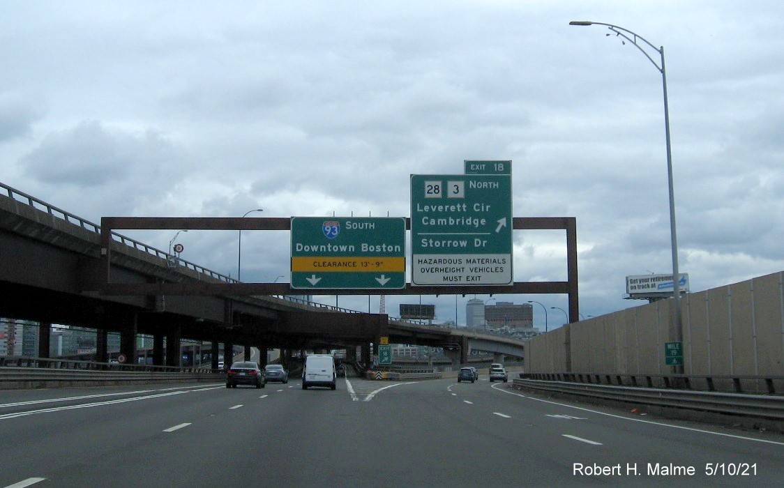 Image of overhead ramp sign for Storrow Drive and MA 28 exit with new milepost based exit number on I-93 South in Charlestown, May 2021
