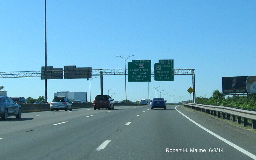 Image of newly placed 1 Mile Advance Overhead Sign for Exits 11A and B behind current overhead sign for Exit 12 on I-93 South in Boston