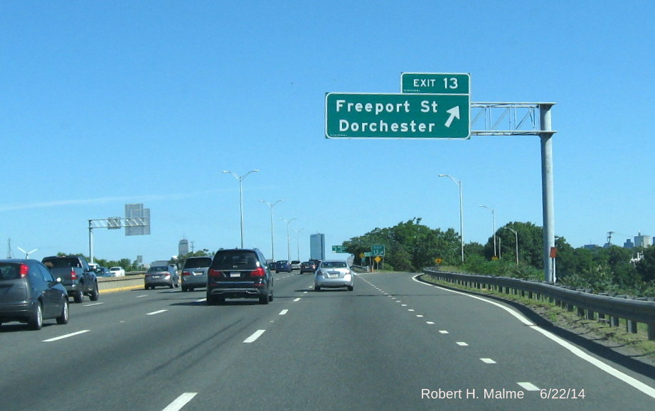 Unobstructed view of new overhead exit sign at Exit 14 off-ramp on i-93 North in Boston
