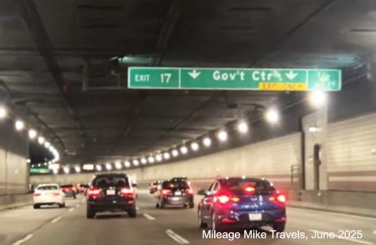 Image of overhead 1/2 mile advance sign for Government Center exit with new 
	milepost based exit numbers on I-93 North in Boston, video capture from Mileage Mile Travels, June 2025