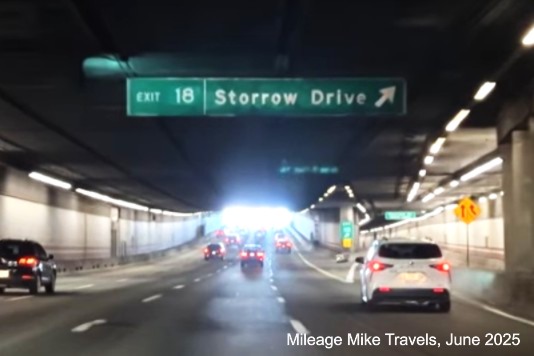 The overhead ramp sign for the Storrow Drive exit with milepost based exit 
	number on I-93 North in Boston, screen grab from Mileage Mile Travels video, June 2025