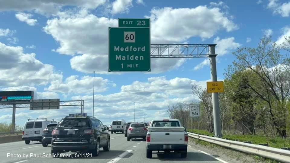 Image of 1 mile advance overhead sign for MA 60 exit with new milepost based exit number and yellow Old Exit 32 sign on support on I-93 North in Medford, by Paul Schlichtman, May 2021