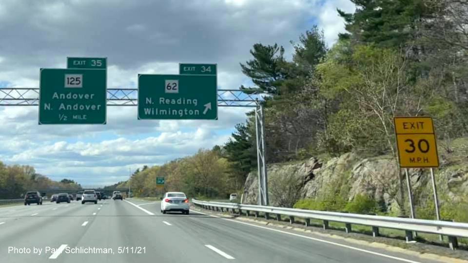 Image of overhead signage at ramp for MA 62 exit with new milepost based exit numbers on I-93 North in Wilmington, by Paul Schlichtman, May 2021
