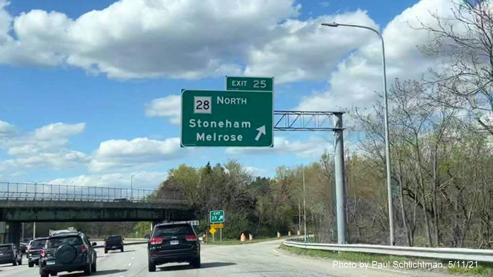 Image of overhead ramp sign for MA 28 North exit with new milepost based exit number on I-93 North in Stoneham, by Paul Schlichtman, May 2021