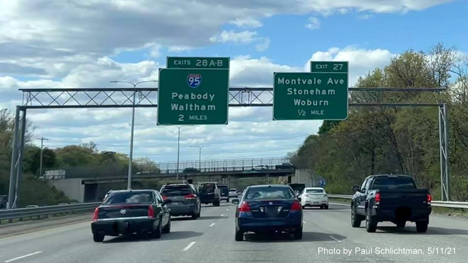 Image of overhead advance signage for I-95 and Montvale Avenue exits with new milepost based exit numbers on I-93 North in Woburn, by Paul Schlichtman, May 2021
