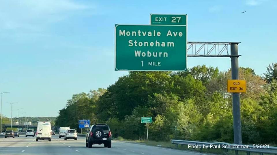 Image of 1 mile advance overhead sign for Montvale Avenue exit with new milepost based exit number and yellow Old Exit 36 advisory sign on support on I-93 South in Reading, by Paul Schlichtman, May 2021