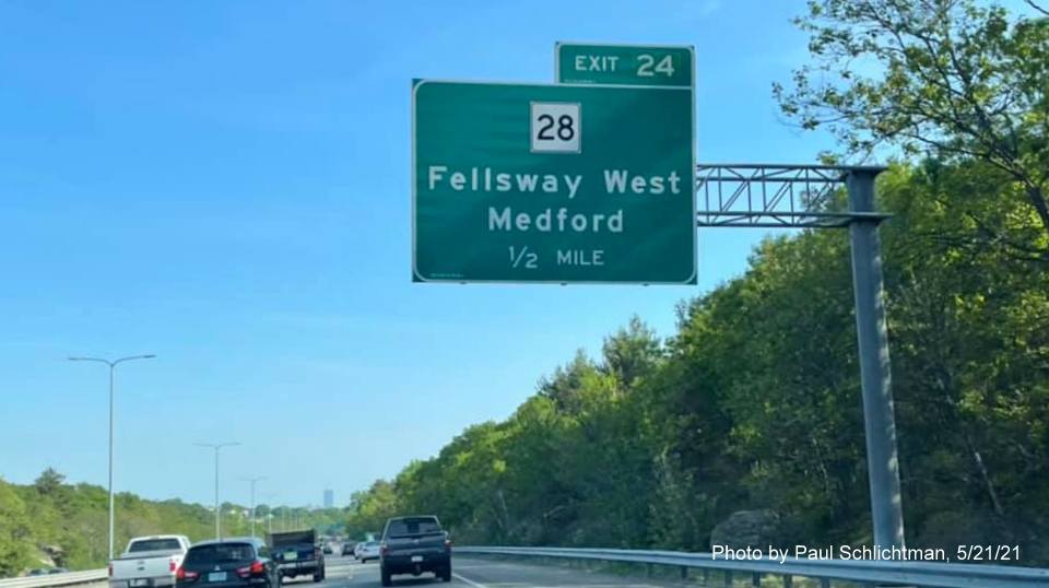 Image of 1/2 mile advance overhead sign for MA 28 Fellsway West exit with new milepost based exit number on I-93 South 
                                            in Medford, May 2021