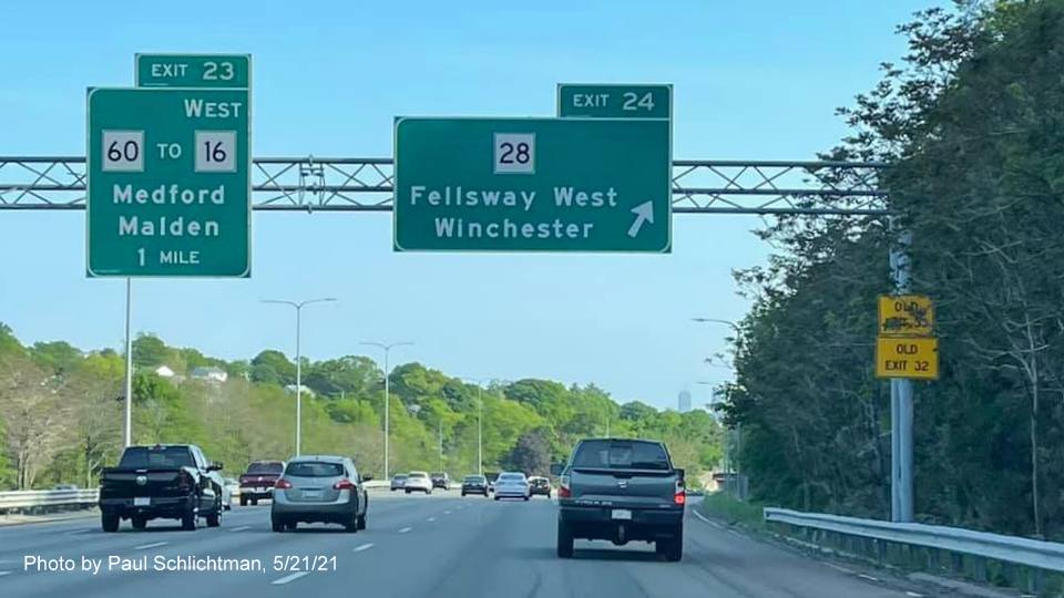 Image of overhead ramp sign for MA 28 Fellsway West exit with new milepost based exit number on I-93 South 
                                            in Medford, May 2021