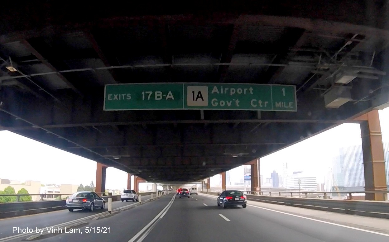 Image of 1 Mile advance bridge mounted sign for MA 1A/Government Center exits with new milepost based exit numbers on I-93 South in Charlestown, by Vinh Lam, May 2021