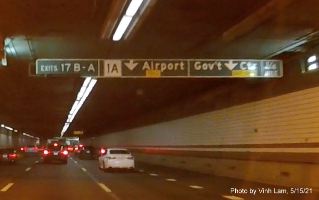 Image of 1/4 Mile tunnel ceiling mounted sign for MA 1A/Government Center exits with new milepost based exit numbers on I-93 South in Boston, by Vinh Lam, May 2021