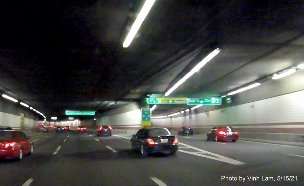 Image of overhead tunnel ceiling mounted ramp sign for MA 1A/Government Center exits with new milepost based exit numbers on I-93 South in Boston, by Vinh Lam, May 2021