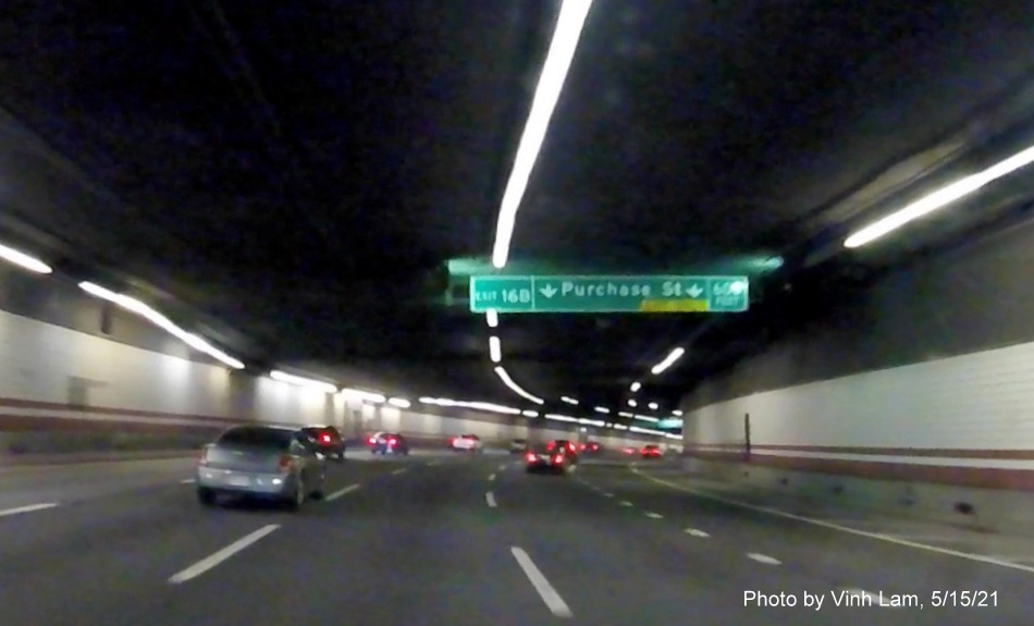 Image of overhead 600 feet advance ceiling mounted sign for Purchase Street exit with new milepost based exit number on I-93 South in Boston, by Vinh Lam, May 2021 