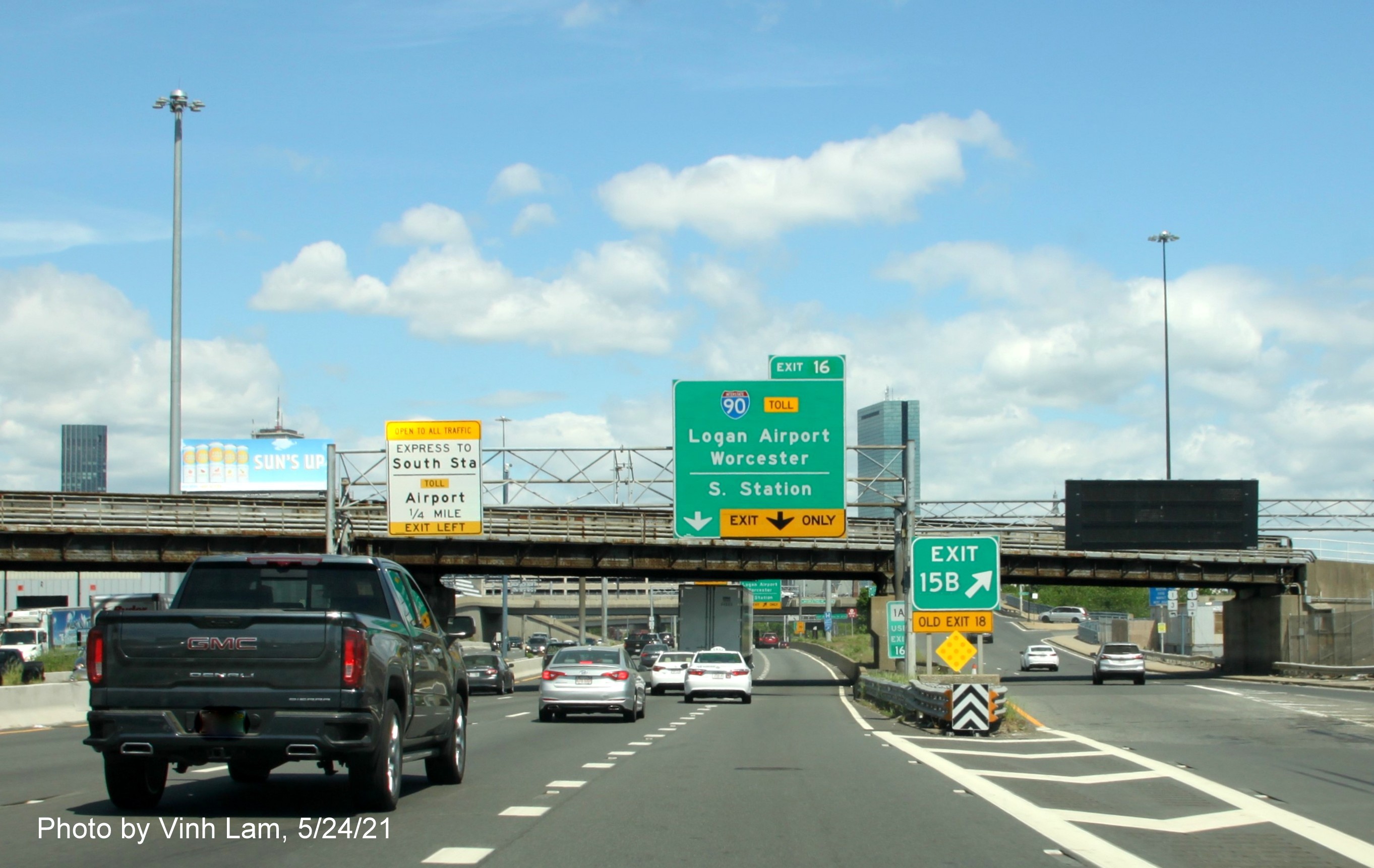 Image of 1/4 mile advance sign for I-90/South Station exit with new milepost based exit number on I-93 North in South Boston, by Vinh Lam, May 2021