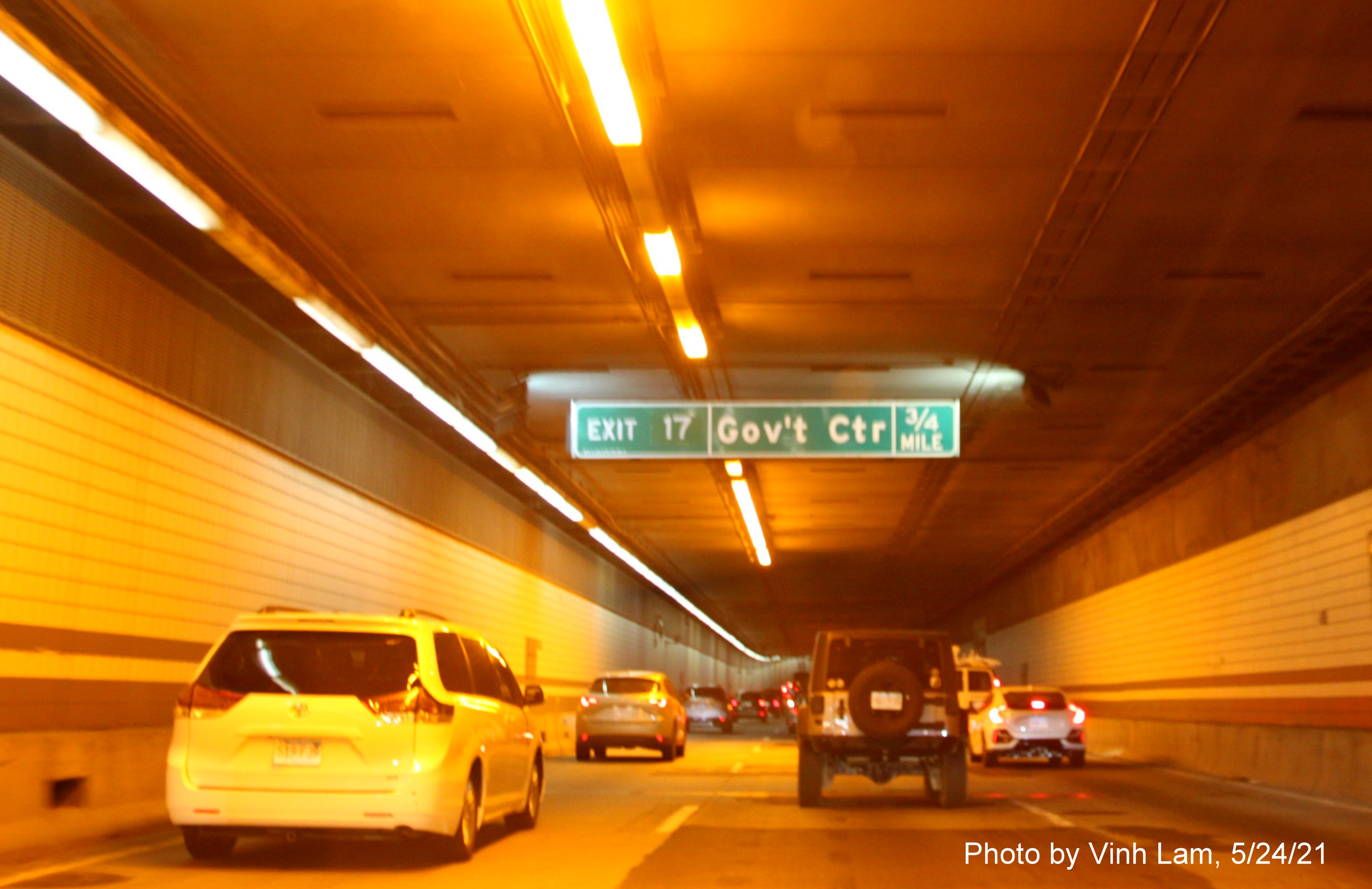 Image of 3/4 mile advance tunnel ceiling mounted sign for Government Center exit with new milepost based exit number on I-93 North in O'Neill Tunnel in Boston, by Vinh Lam, May 2021 
