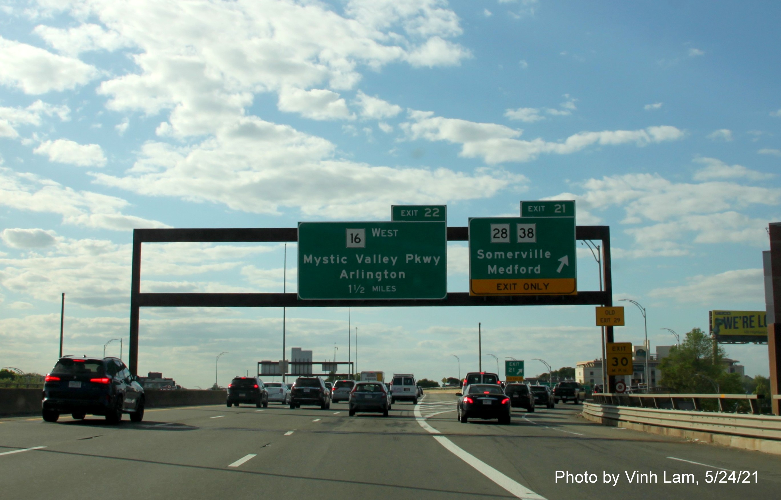 Image of overhead ramp sign for MA 28/38 exit with new milepost based exit number on I-93 North in Somerville, by Vinh Lam, May 2021