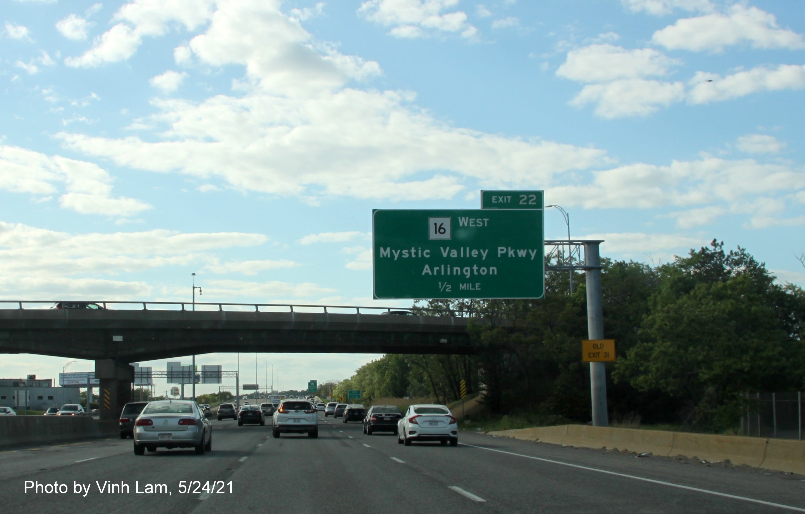 Image of 1/2 mile advance sign for MA 16 West exit with new milepost based exit number on I-93 North in Medford, by Vinh Lam, May 2021