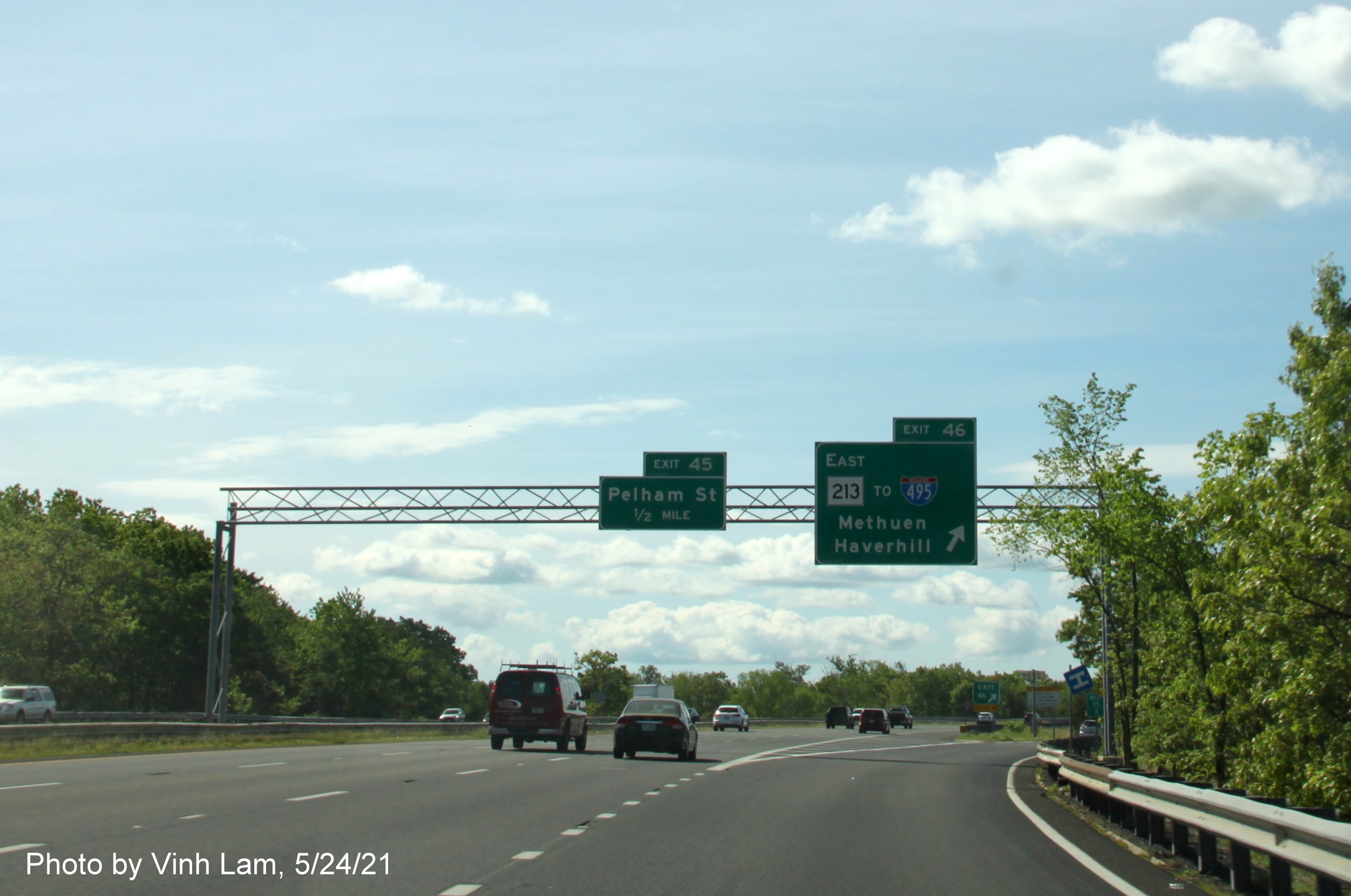 Image of overhead ramp sign for MA 213 exit with new milepost based exit number on I-93 South in Methuen, by Vinh Lam, May 2021