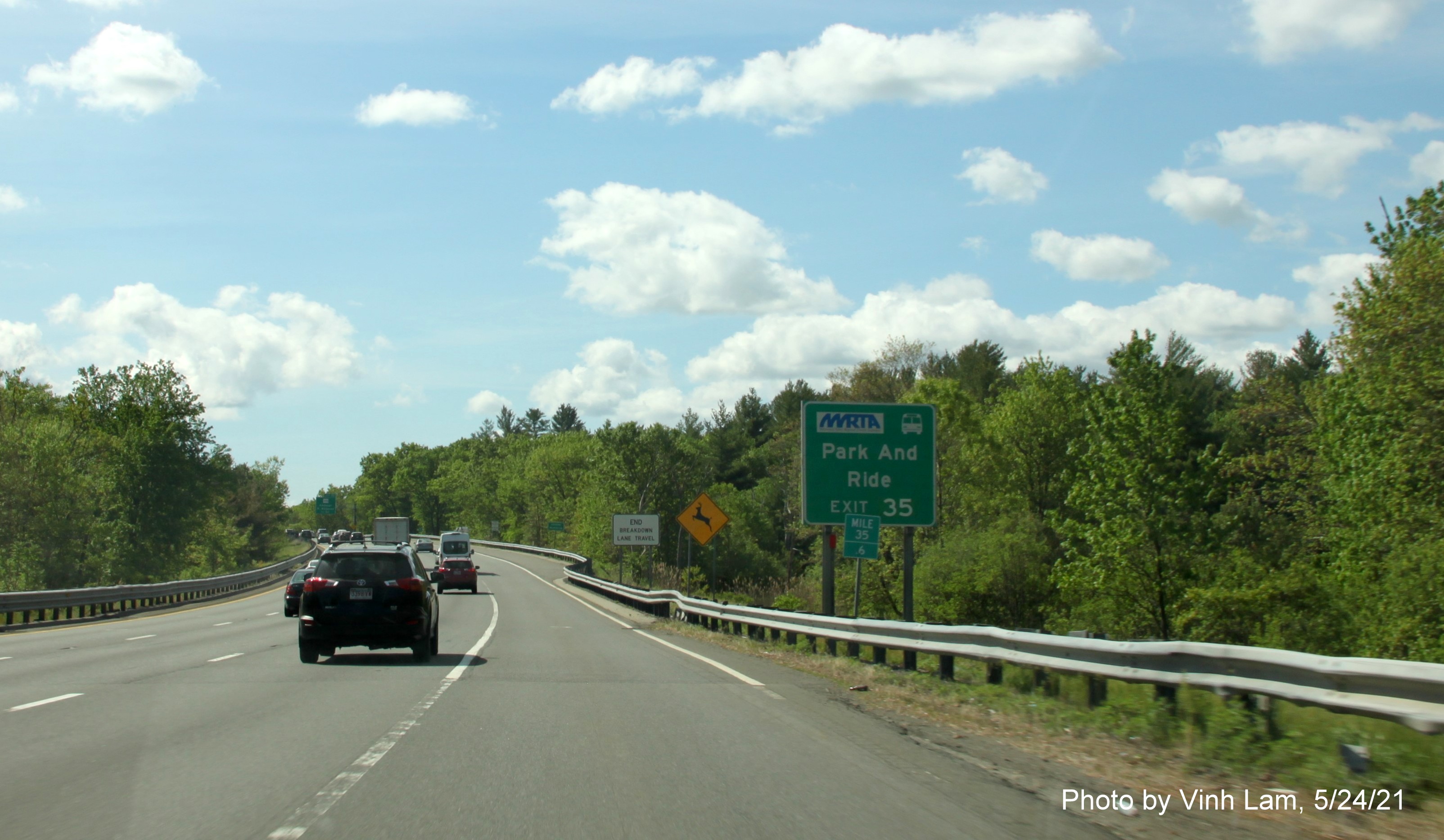 Image of auxiliary sign for MA 125 exit with new milepost based exit number on I-93 South in Wilmington, by Vinh Lam, May 2021
