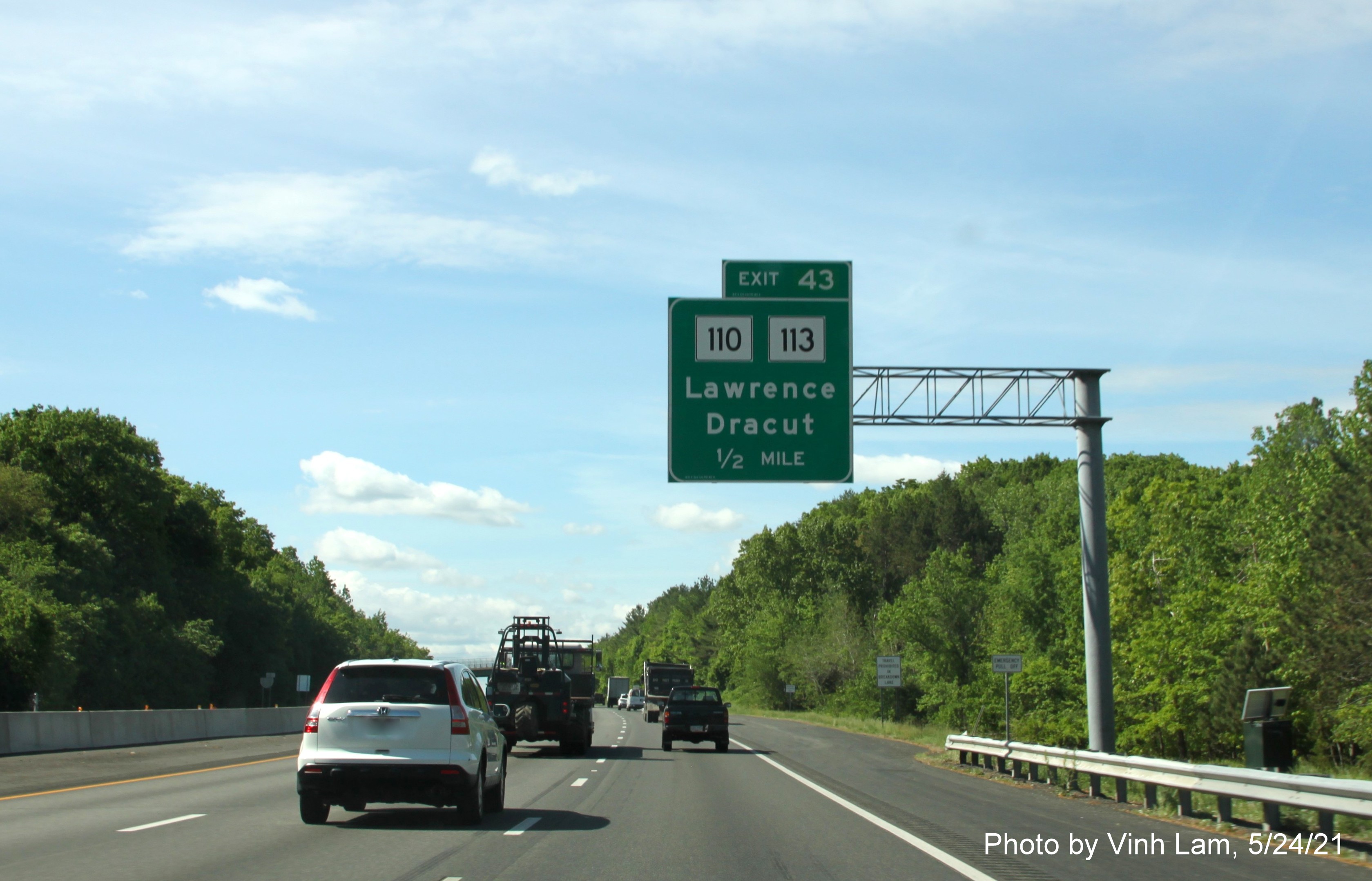 Image of 1/2 mile advance overhead sign for MA 110/113 exit with new milepost based exit number on I-93 South in Andover, by Vinh Lam, May 2021