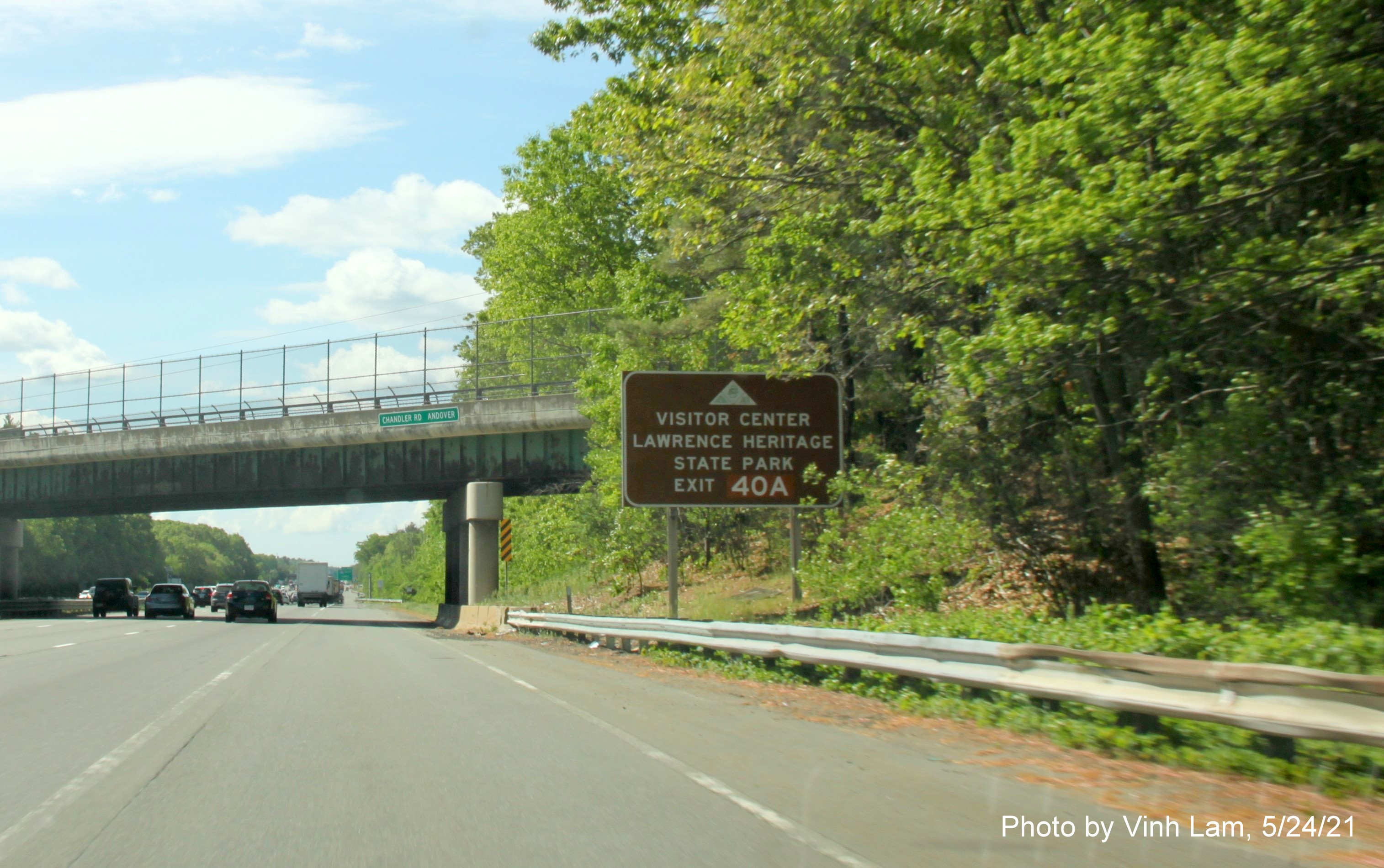 Image of brown attraction auxiliary sign for I-495 South exit with new milepost based exit number on I-93 South in Andover, by Vinh Lam, May 2021