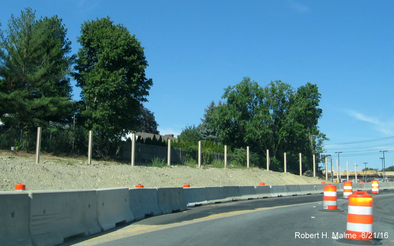 Image of noise barriers being placed along reconfigured Highland Ave. ramps to and from I-95 South in Needham