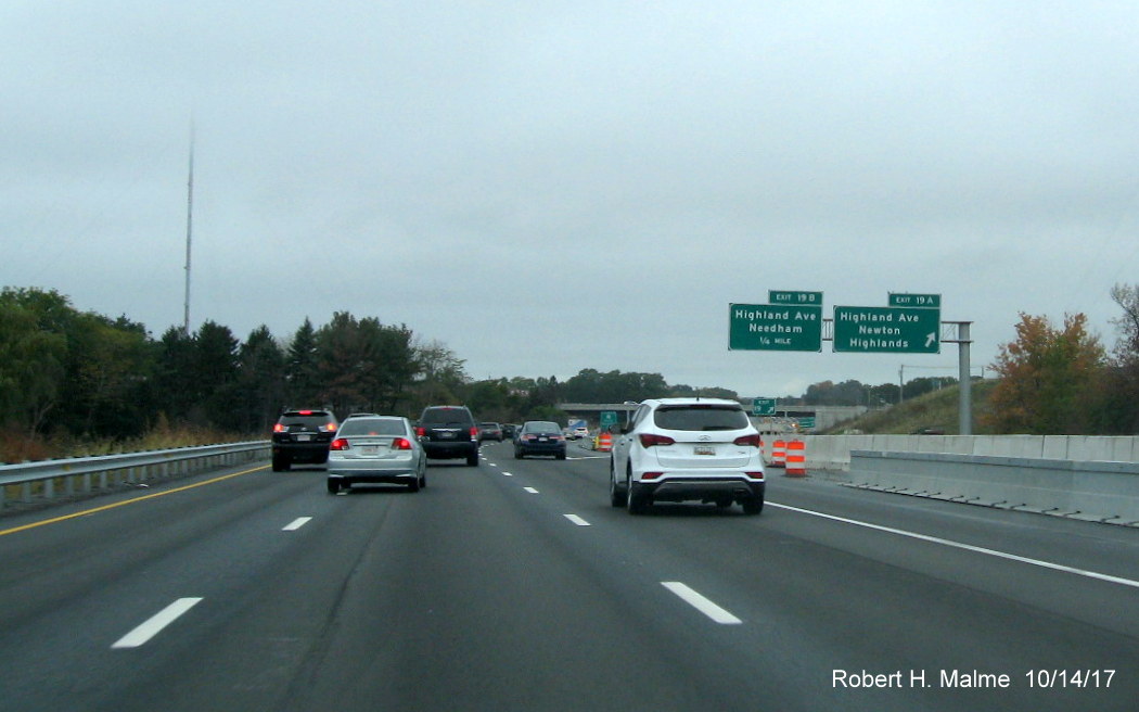 Image of newly placed 2 sign cantilever overhead exit signs for Highland Ave on I-95 North in Add-A-Lane Project work zone in Needham
