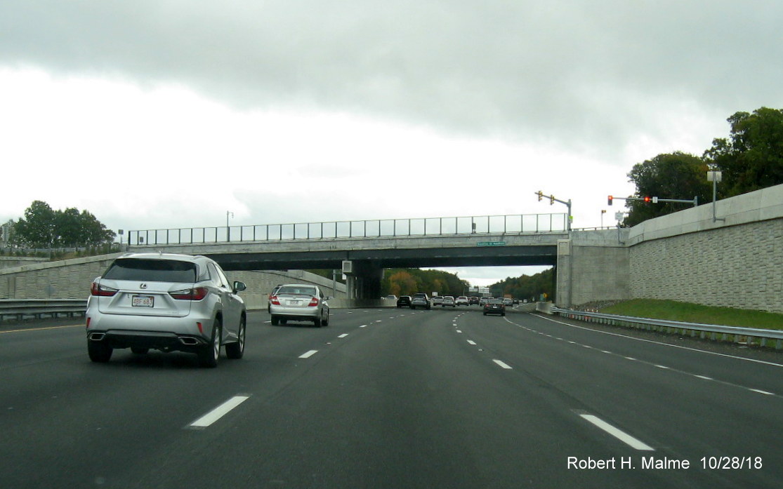 Image of five open lanes of traffic traveling under Kendrick St bridge on I-95 South in completed Add-A-Lane Project work zone in Needham