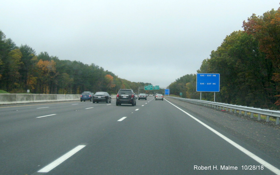 Image of still to be completed blue service signs in completed Add-A-Lane Project work zone on I-95 North in Needham