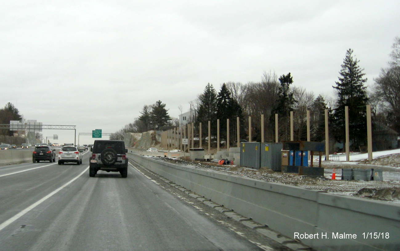Image of noise wall supports being constructed at merge of MA 9 exit on-ramp with I-95 south in Add-A-Lane Project work zone in Needham