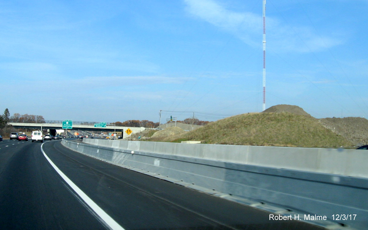 Image of large dirt mounds between ramps from Highland Ave to I-95 North in Add-A-Lane Project work zone in Needham