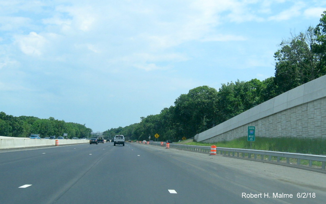 Image of new Mile 35 marker in shoulder of I-95 South beyond Kendrick St in Add-A-Lane Project work zone in Needham