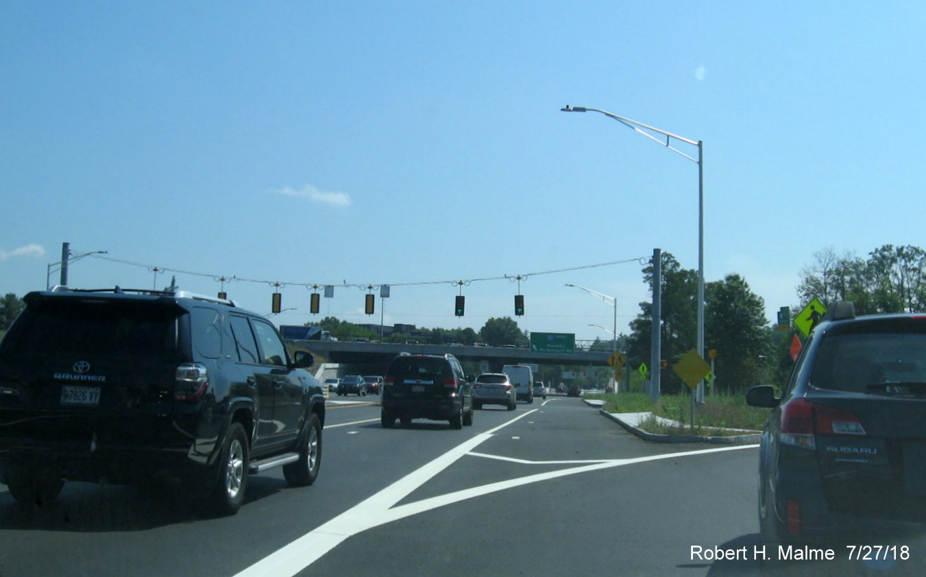 Image of permanent traffic signals and overhead signs for I-95 North ramp off of MA 9 East as part of Add-A-Lane Project in Wellesley