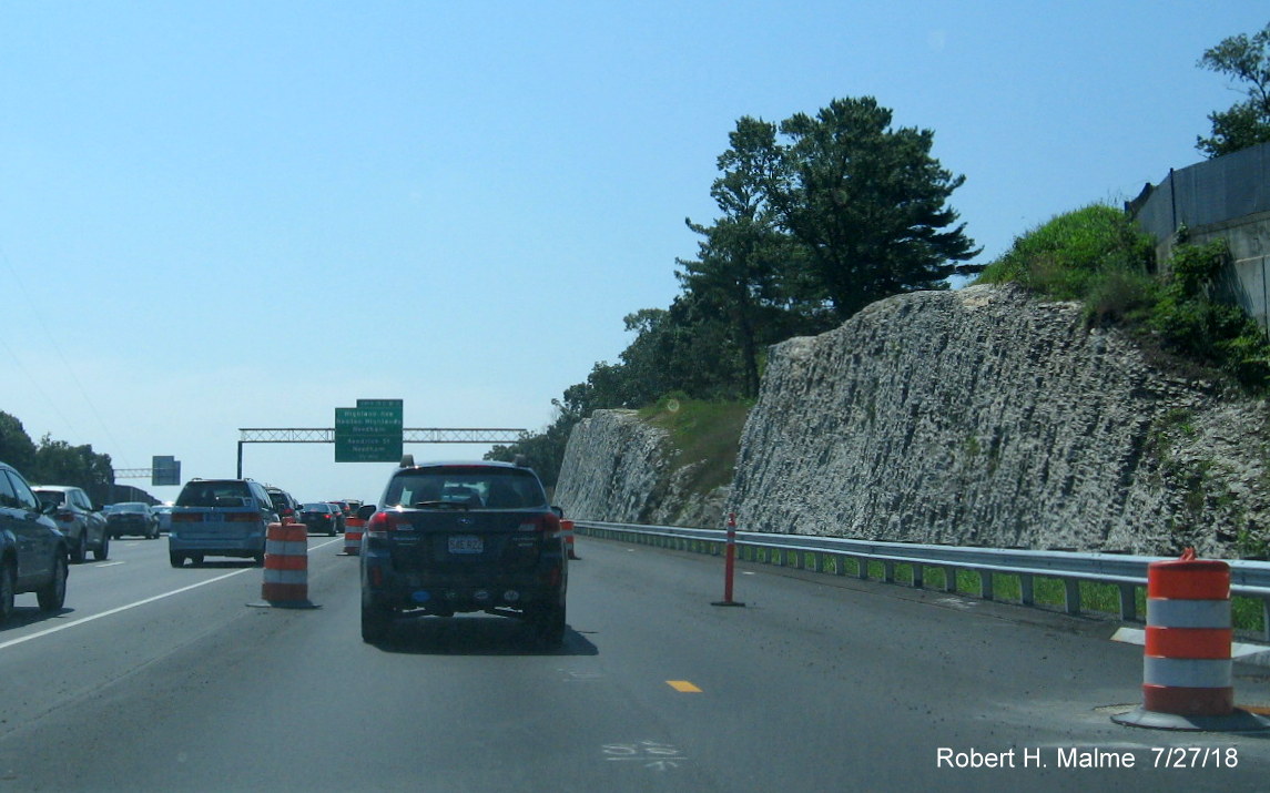 Image of rock face newly exposed by ramp expansion work on I-95 South in Add-A-Lane Project work zone in Needham