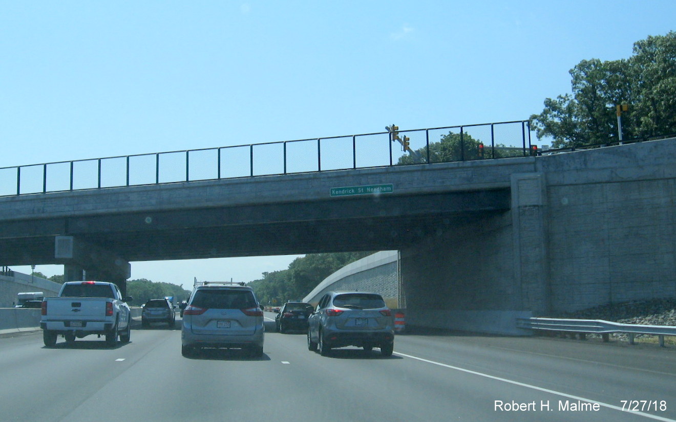 Image of new street and town identifier sign on Kendrick St bridge over I-95 South in Add-A-Lane Project work zone in Needham