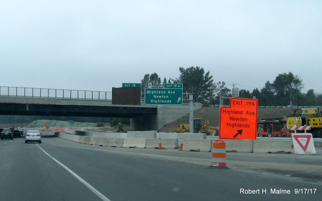 Image of temporary and permanent exit signage for Highland Ave along I-95 South in Needham