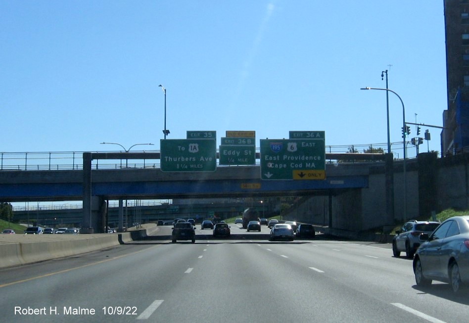 Image of overhead signage from street overlooking I-95 South showing new milepost based exit numbers for Eddy Street, I-195/US 6 East and Thurbers Avenue exit, by Joseph Bong, September 2022