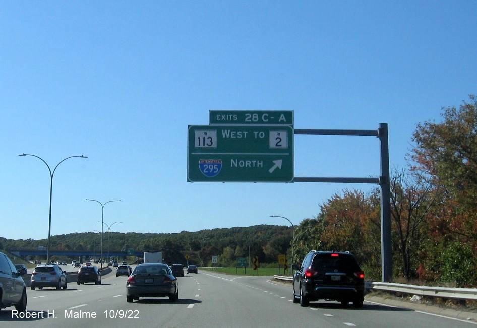 Image of 1 mile advance overhead sign for RI 113 and To I-295 North exits with new milepost based exit number on I-95 South in Warwick, October 2022