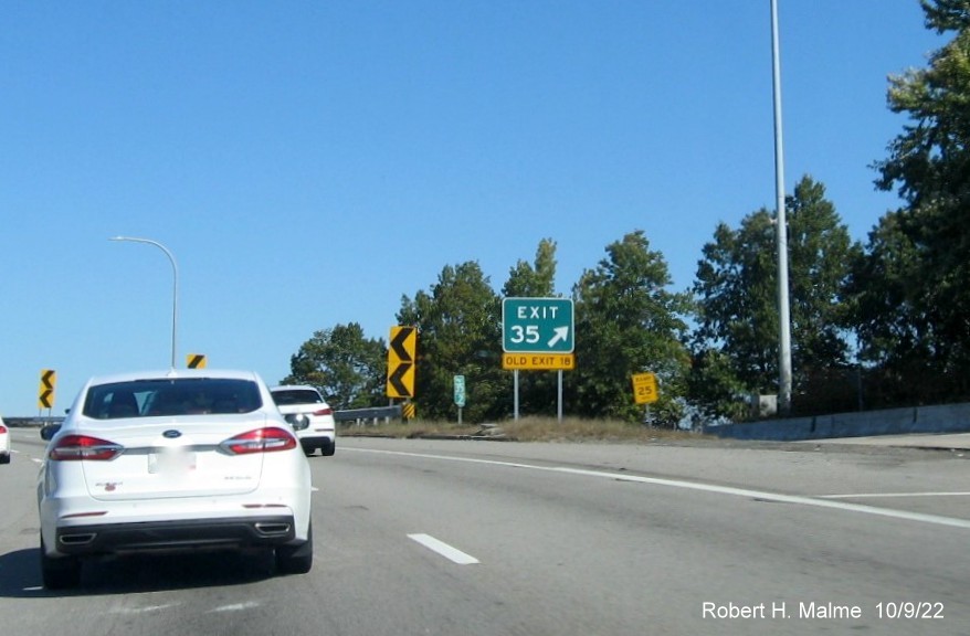 Image of gore sign for US 1A exit with new milepost based exit number and yellow Old Exit 18 sign below on I-95 North in Providence,  October 2022