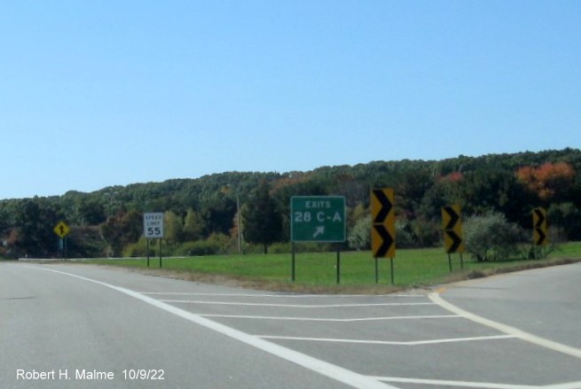 Image of gore sign for RI 113 West and To I-295 North exits with new milepost based exit number on I-95 South in Warwick, October 2022