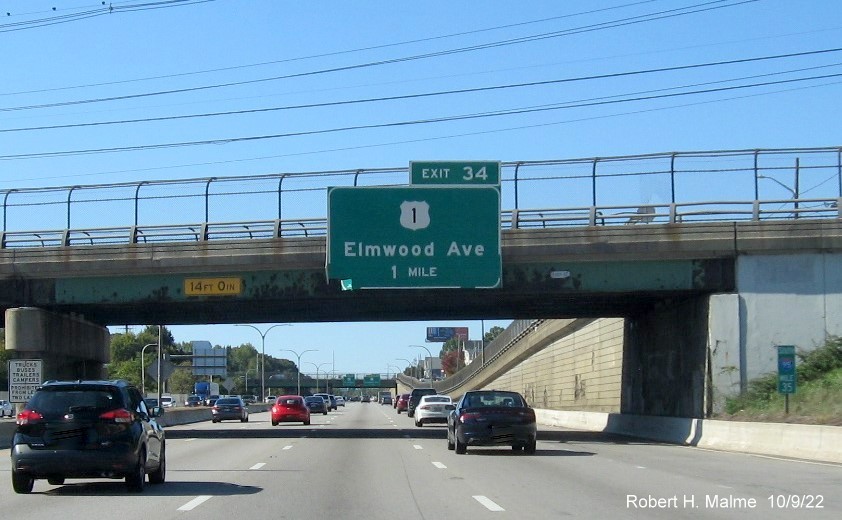 Image of bridge mounted 1 mile advance sign for US 1/Elmwood Avenue exit with new milepost based exit number on I-95 South in Providence, October 2022