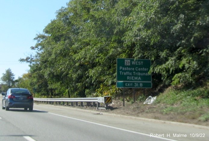 Image of auxiliary sign for RI 37 West exit with new milepost based exit number on I-95 South in Warwick, October 2022