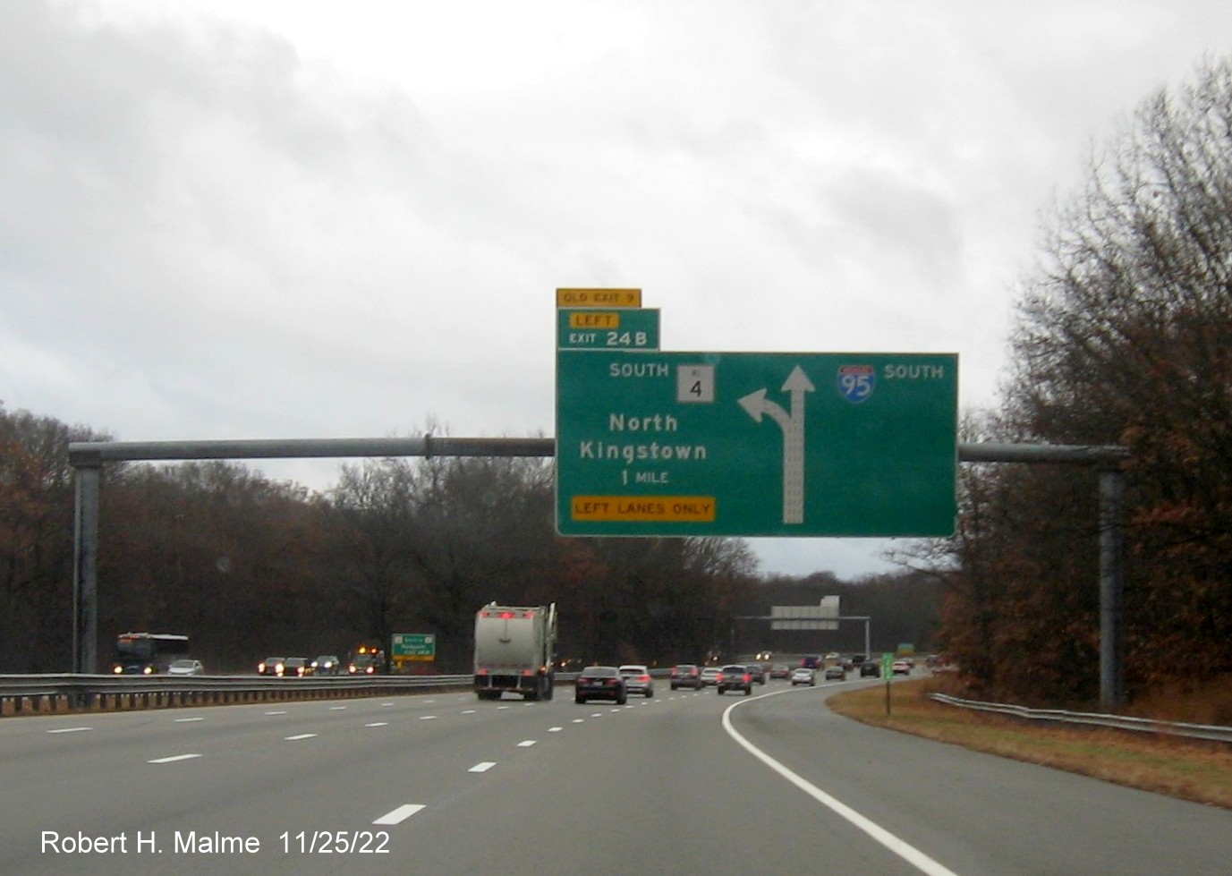 Image of 1 mile advance overhead diagrammatic sign for RI 4 South exit with new milepost based exit number and yellow Old Exit 9 advisory sign over exit tab on I-95 South in Warwick, November 2022