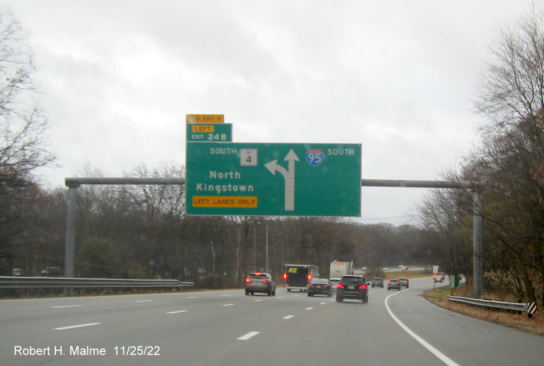 Image of 1/2 mile advance overhead diagrammatic sign for RI 4 South exit with new milepost based exit number and yellow Old Exit 9 advisory sign over exit tab on I-95 South in Warwick, November 2022
