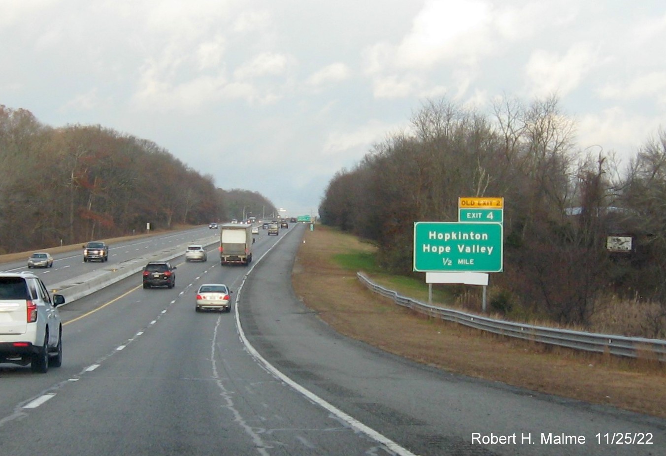 Image of ground mounted 1/2 mile advance sign for the Hopkinton exit with new milepost based exit numbers and yellow Old Exit 2 sign above exit tab on I-95 South, November 2022
