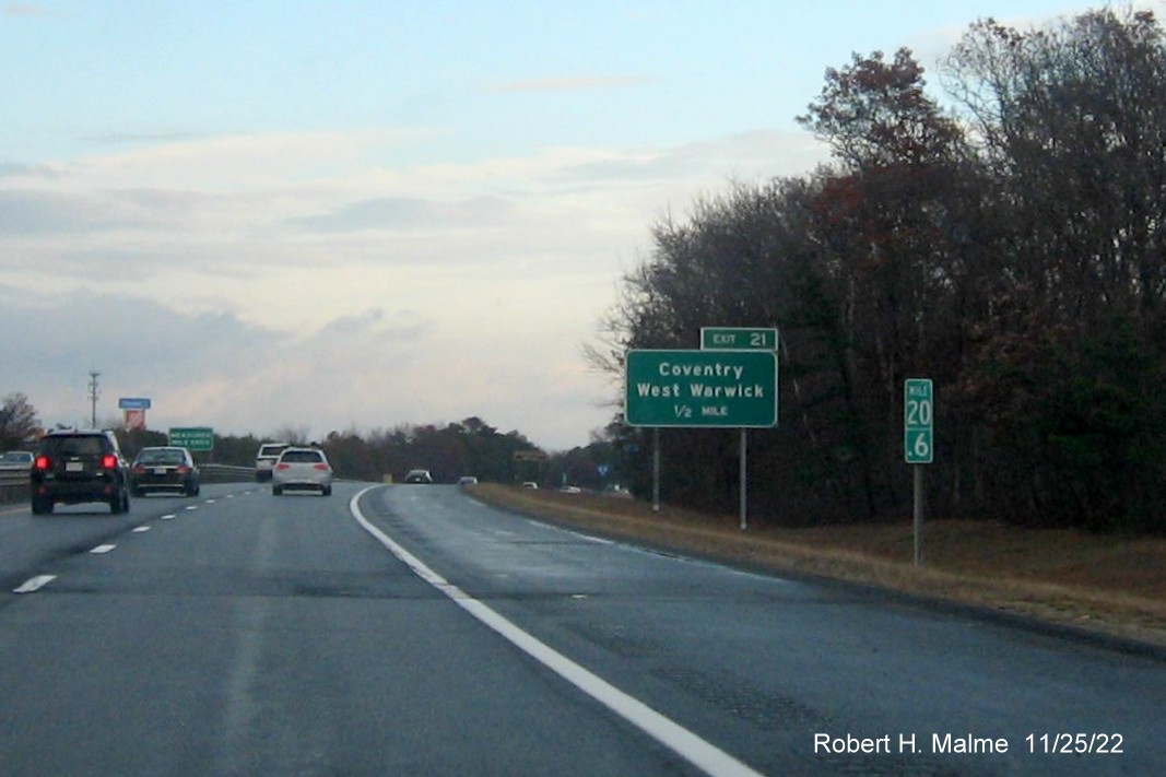 Image of ground mouted 1/2 mile advance sign for Coventry/West Warwick exit with new milepost based exit number, but no old exit number sign, on I-95 North, November 2022